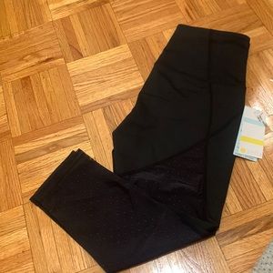 NWT Zella black leggings. Mesh polka dot detail down back of leg. Size medium.